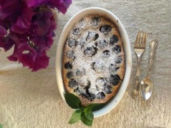 cherry clafoutis in an oval baking dish