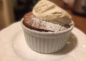 Chocolate soufflé topped with brown sugar whipped cream