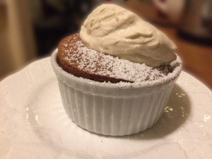 Chocolate souffle topped with brown sugar whipped cream