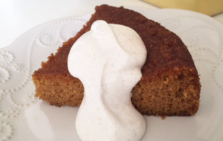 A slice of cake with cream topping