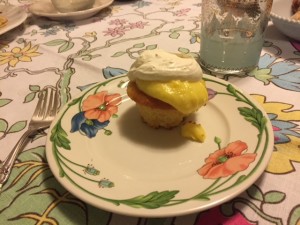 lemon yogurt cake with whipped cream on a fancy plate.